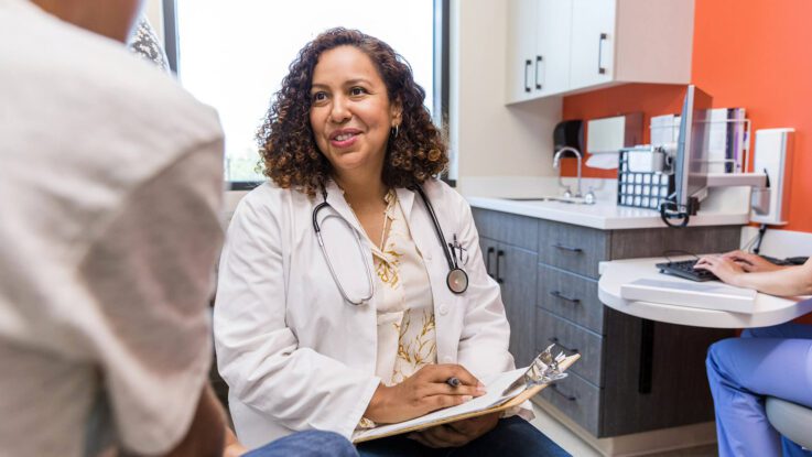 a female nurse consulting with a patient